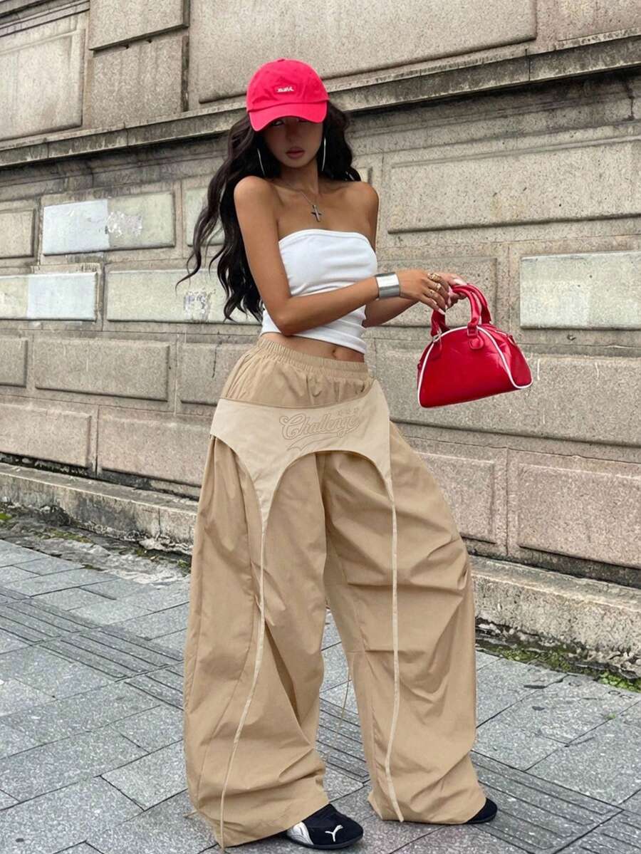 Women's casual wide leg long pants featuring an elastic drawstring waistband and loose fit silhouette.