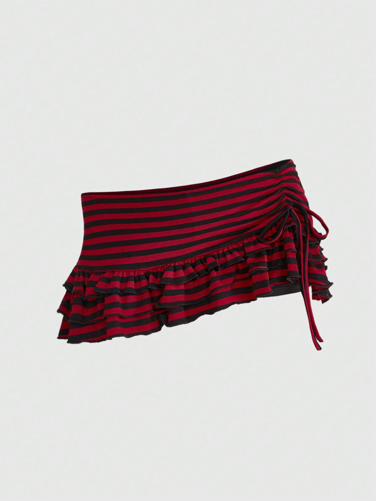 Women's low-waist leopard print mini skirt with drawstring tie-up, ruched detail, layered ruffle hem, and asymmetric grunge punk styling