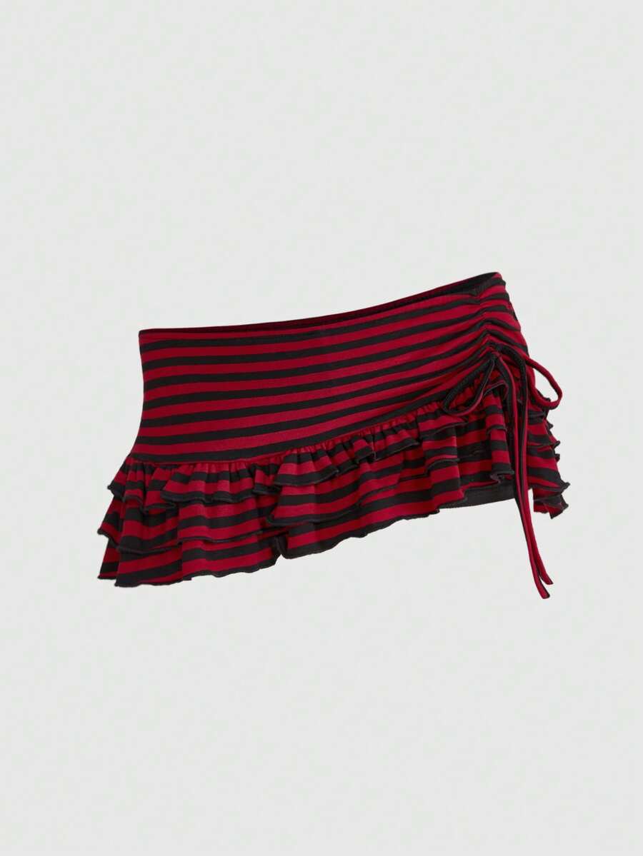 Women's black low-waist mini skirt with drawstring tie, ruched details, lace trim, layered ruffle hem, and asymmetric styling