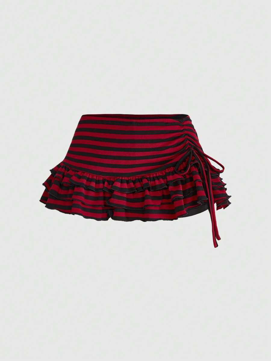 Women's low-waist leopard print mini skirt with drawstring tie-up, ruched detail, layered ruffle hem, and asymmetric grunge punk styling