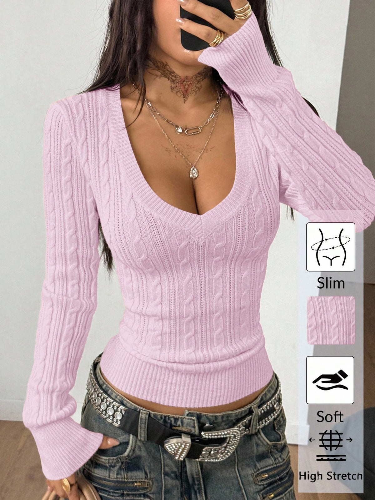 Women's slim fit cable-knit sweater with a V-neckline and long sleeves in solid green rib knit fabric.