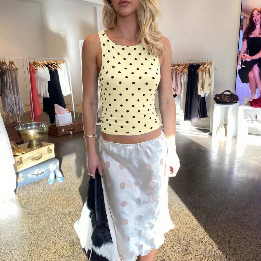 Women's polka dot sleeveless tank top with round neck, ruched rib-knit detail, regular hem, and slim fit casual style