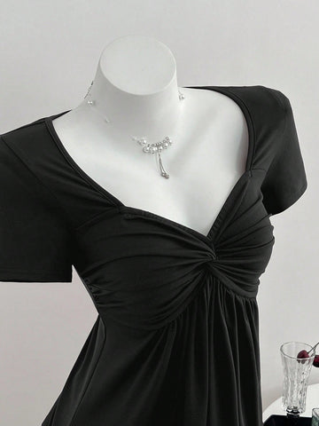 Women's short sleeve V-neck T-shirt featuring a front twist knot detail and slim fit.