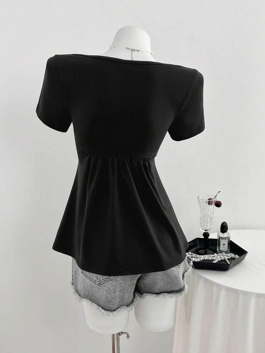 Women's short sleeve V-neck T-shirt featuring a front twist knot detail and slim fit.