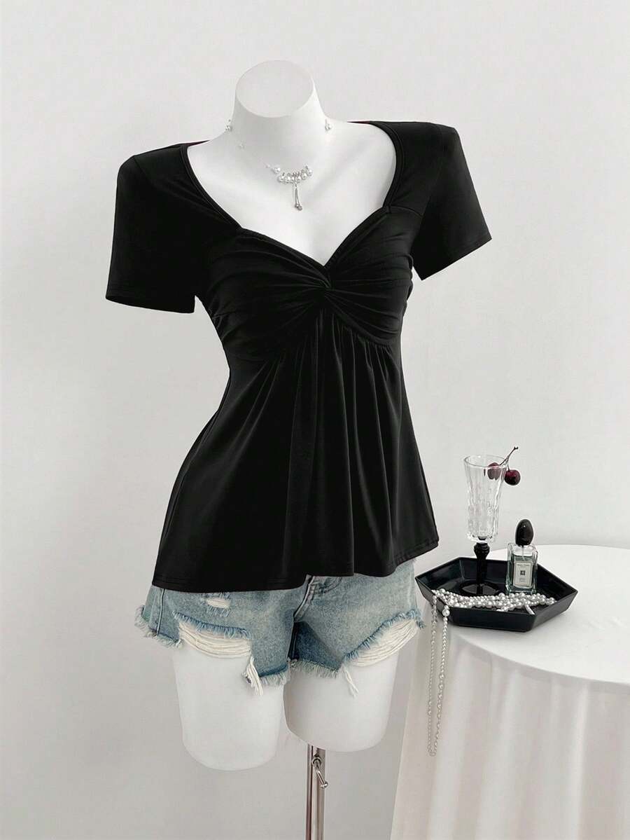 Women's short sleeve V-neck T-shirt featuring a front twist knot detail and slim fit.