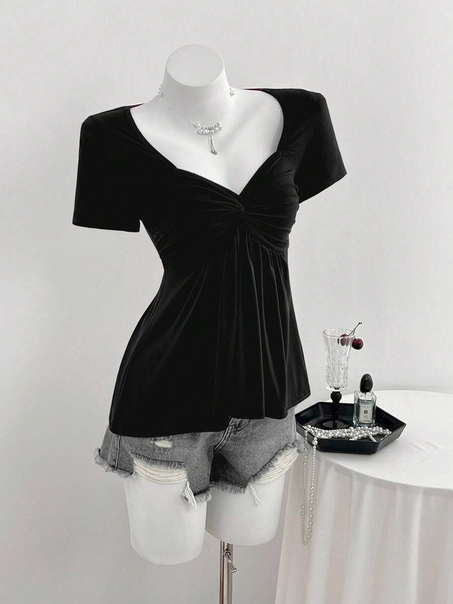 Women's short sleeve V-neck T-shirt featuring a front twist knot detail and slim fit.