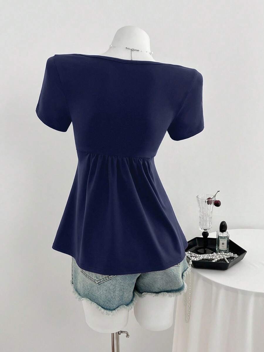 Women's short sleeve V-neck T-shirt featuring a front twist knot detail and slim fit.