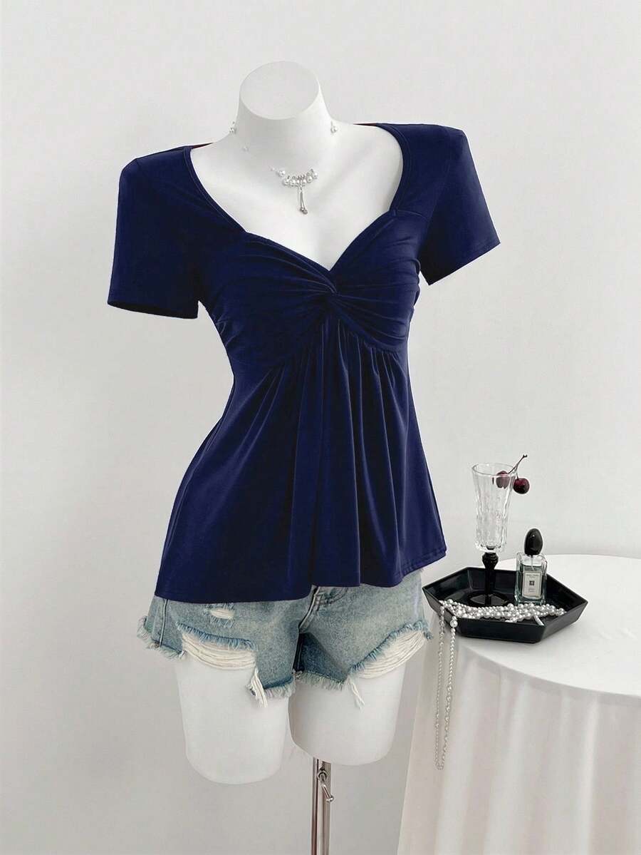 Women's short sleeve V-neck T-shirt featuring a front twist knot detail and slim fit.