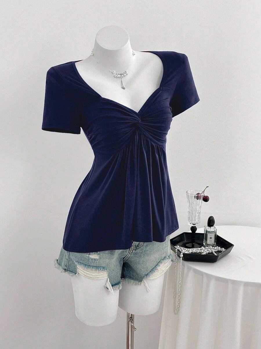 Women's short sleeve V-neck T-shirt featuring a front twist knot detail and slim fit.