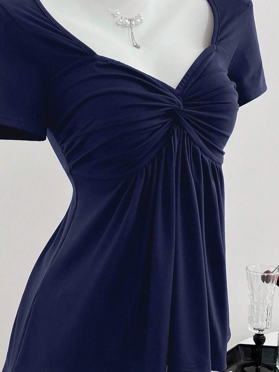 Women's short sleeve V-neck T-shirt featuring a front twist knot detail and slim fit.
