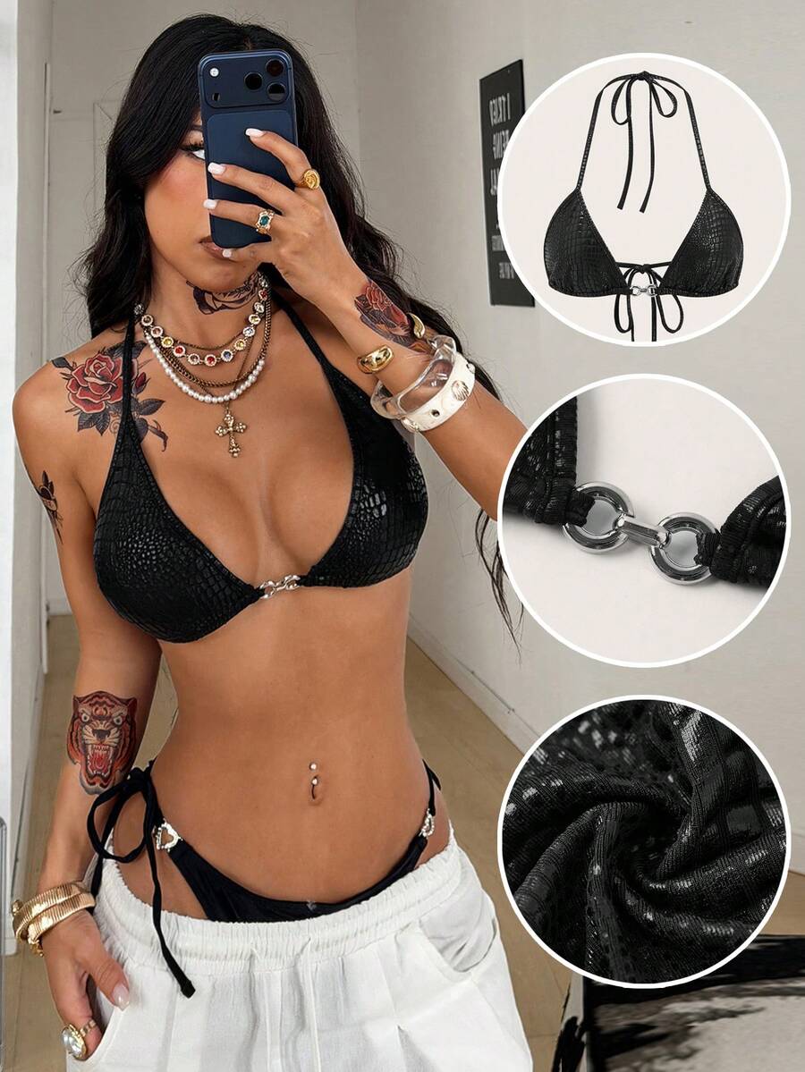 Women's slim fit halter crop top featuring a backless cut with knot and rhinestone accents.