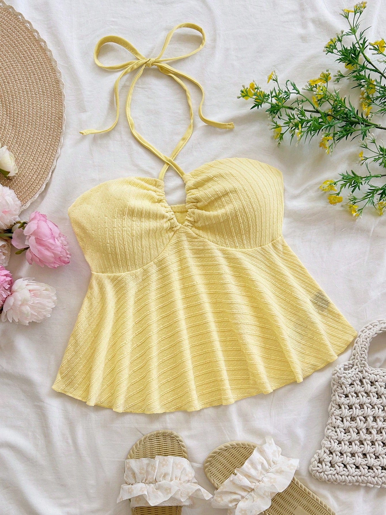 Women's textured V-neck halter tank top with backless knot detail, ruffle hem, and flared silhouette for casual beach and vacation wear.