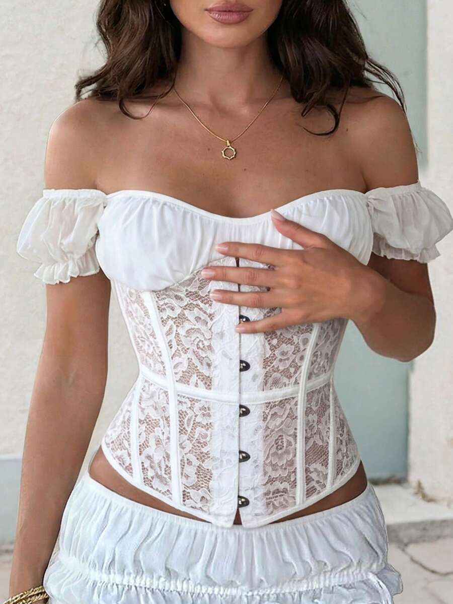 Front view of a vintage lace corset crop top featuring boned structure, square neckline, and lace-up details.