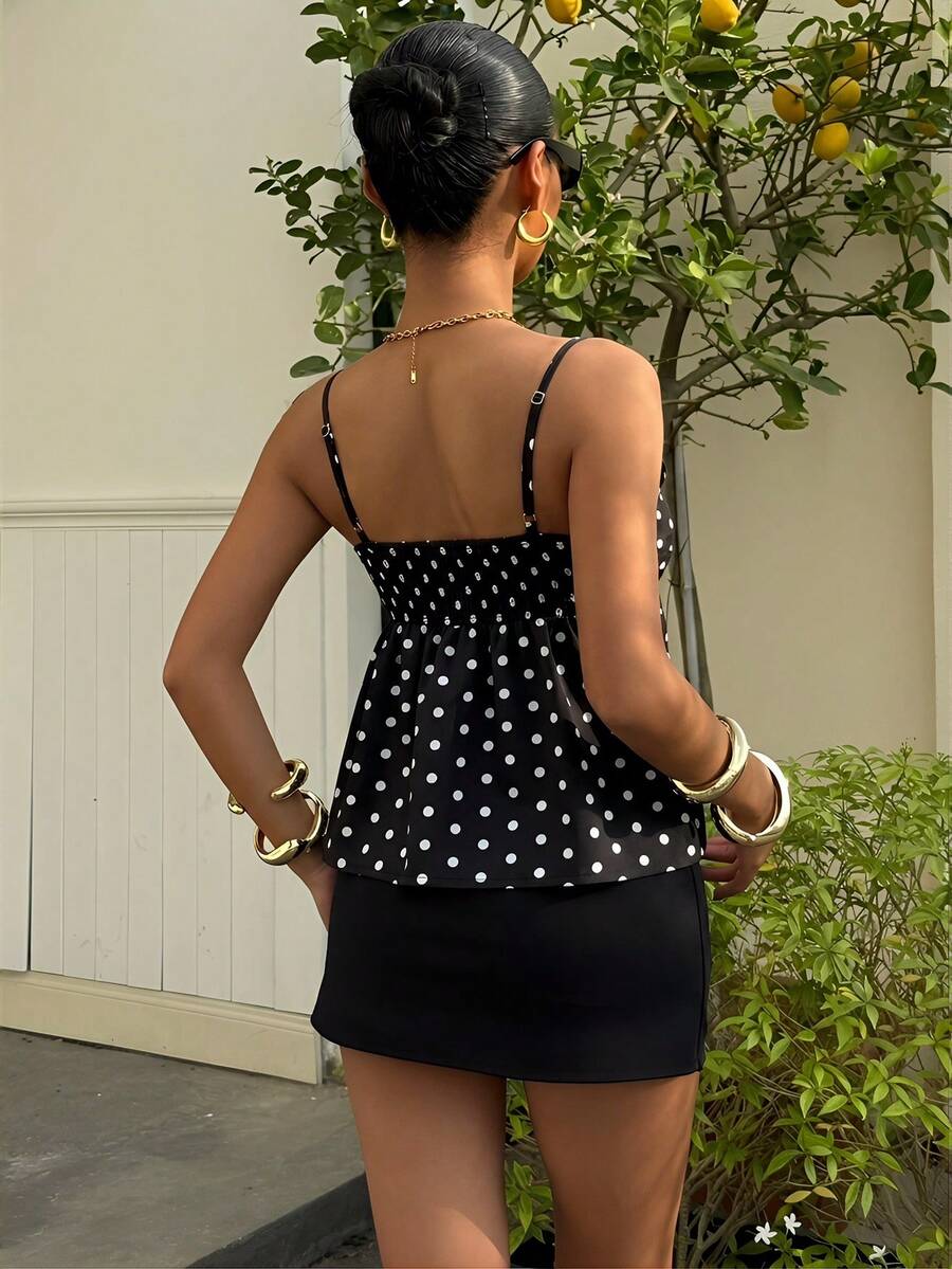 Women's casual geometric cami top with spaghetti straps, backless wrap styling, button front, and asymmetrical hem.
