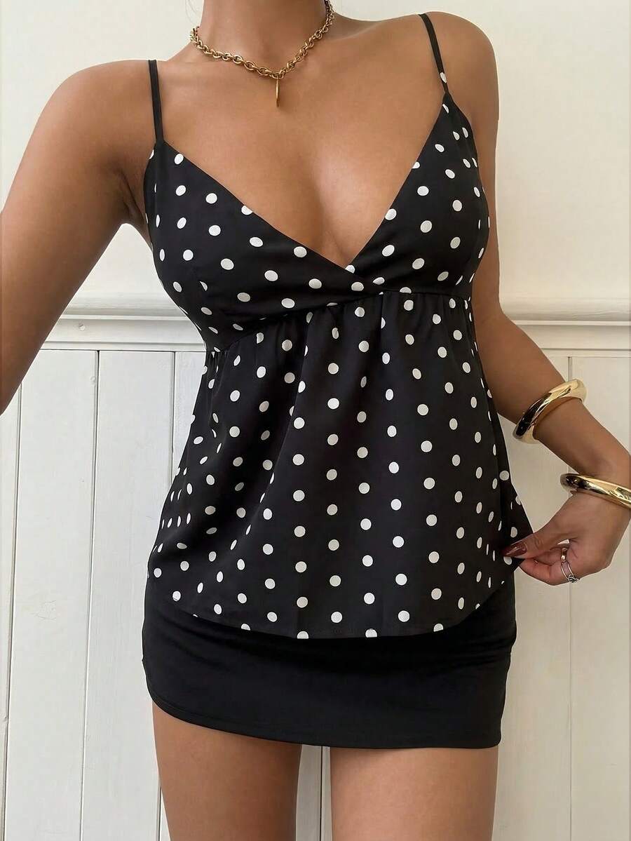 Women's casual geometric cami top with spaghetti straps, backless wrap styling, button front, and asymmetrical hem.