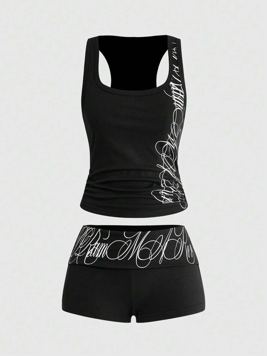 Punk-inspired two-piece set with a fitted scoop neck slogan tank top featuring cross and rhinestone details paired with ultra low waist mini shorts.