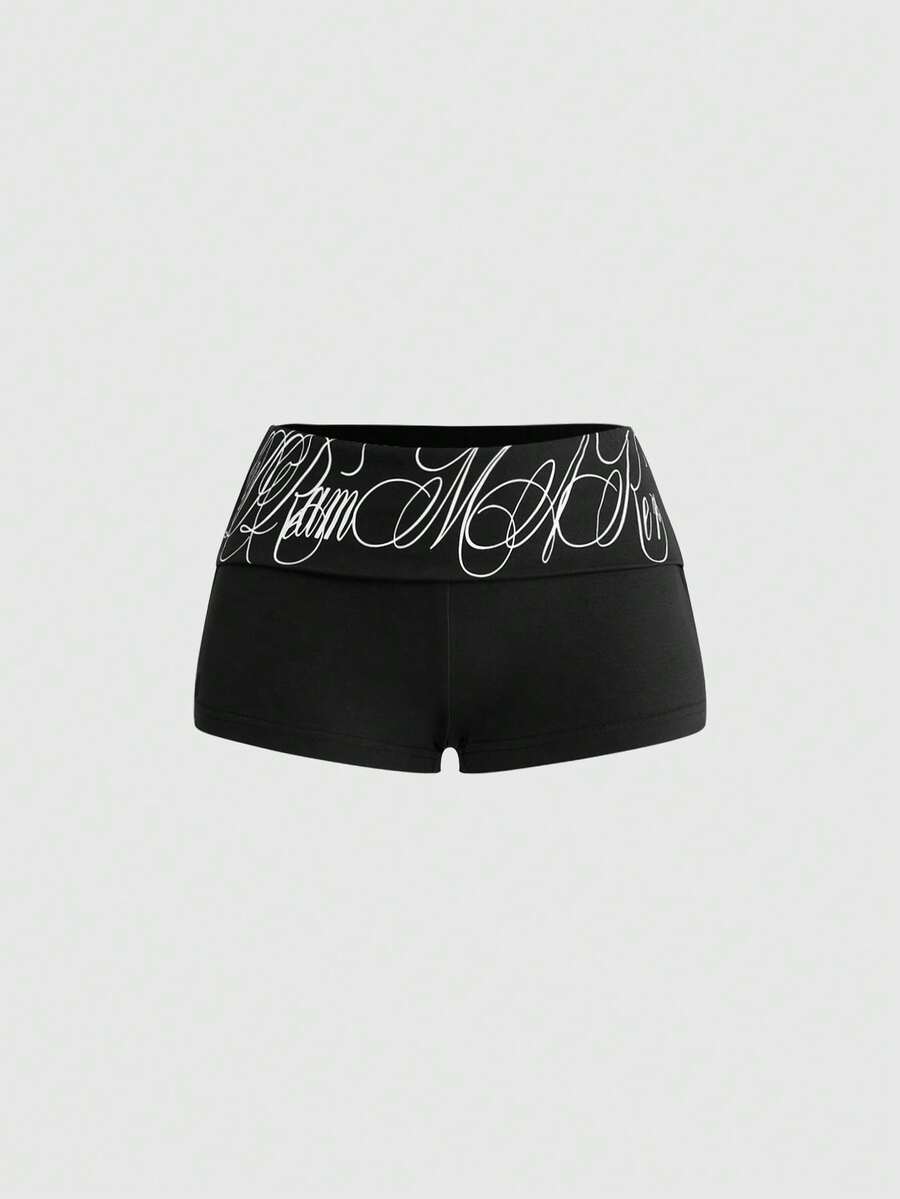 Punk-inspired two-piece set with a fitted scoop neck slogan tank top featuring cross and rhinestone details paired with ultra low waist mini shorts.