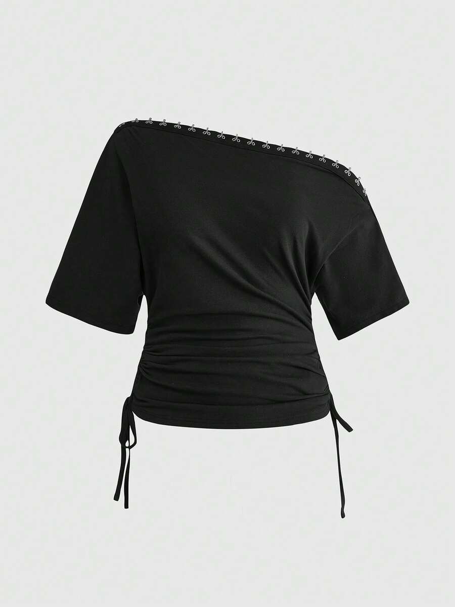 Women's slim fit short sleeve t-shirt featuring an asymmetric off-the-shoulder neckline, ruched design, and metal buckle detail.