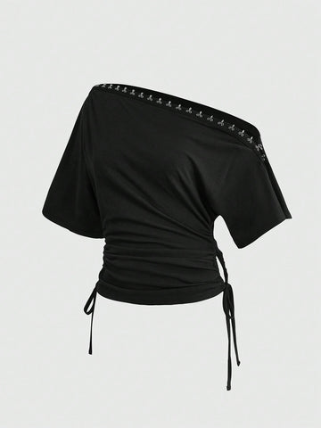 Women's slim fit short sleeve t-shirt featuring an asymmetric off-the-shoulder neckline, ruched design, and metal buckle detail.