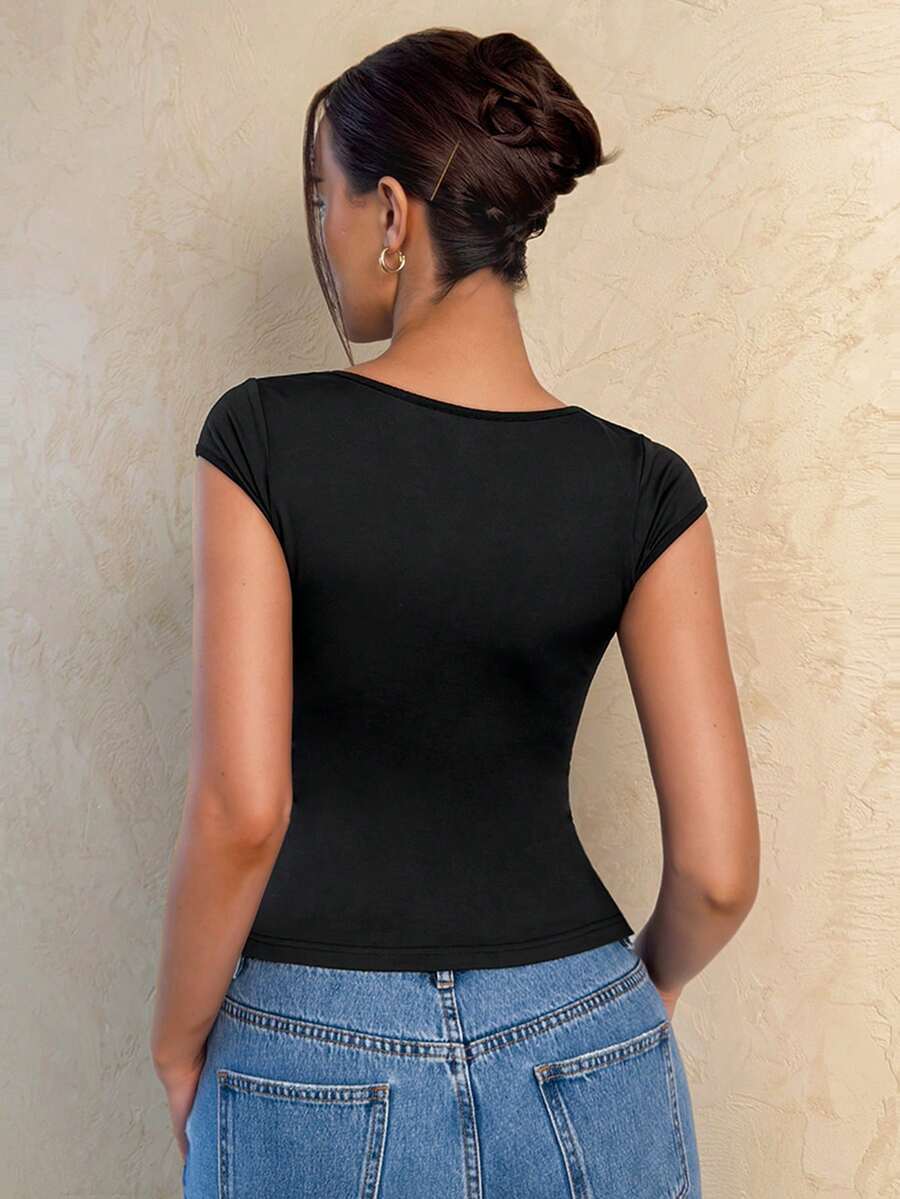 Women's black slim fit knitted t-shirt featuring a deep V-neckline, cap sleeves, cut-out frill details, and a ruched front.