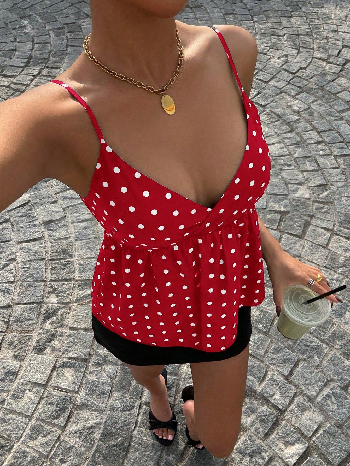 Women's casual geometric cami top with spaghetti straps, backless wrap styling, button front, and asymmetrical hem.