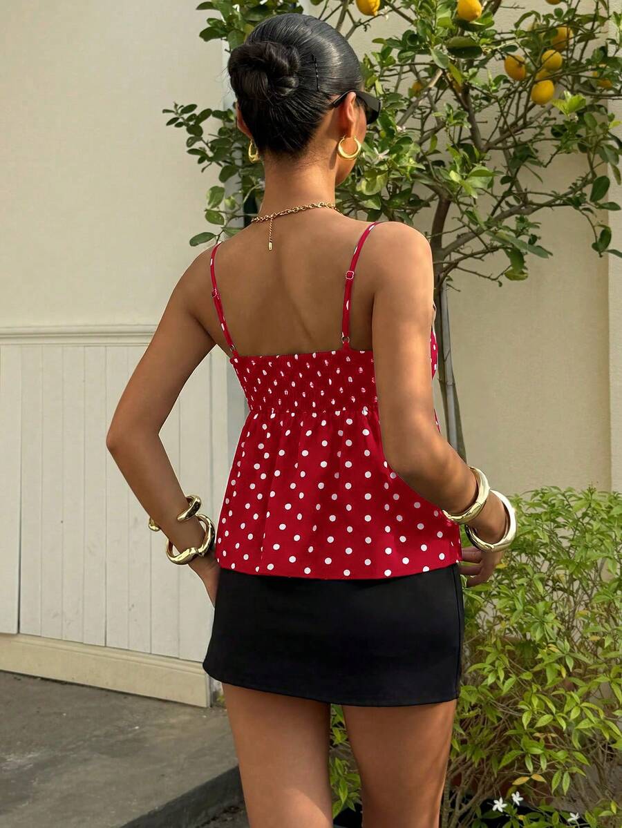 Women's casual geometric cami top with spaghetti straps, backless wrap styling, button front, and asymmetrical hem.
