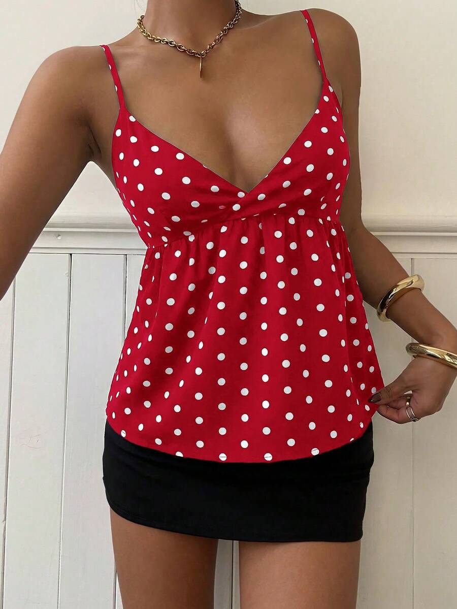 Women's casual geometric cami top with spaghetti straps, backless wrap styling, button front, and asymmetrical hem.