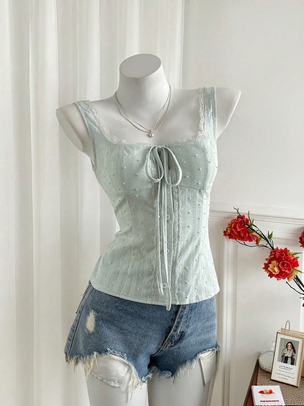 Women's 100% cotton sleeveless camisole top featuring a square neckline, wide straps, lace-up knot detail, and an asymmetrical hem.
