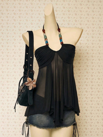 Women's boho halter mesh tank top with asymmetrical hem, semi-sheer finish, lined body, slim fit, and cold shoulder styling.