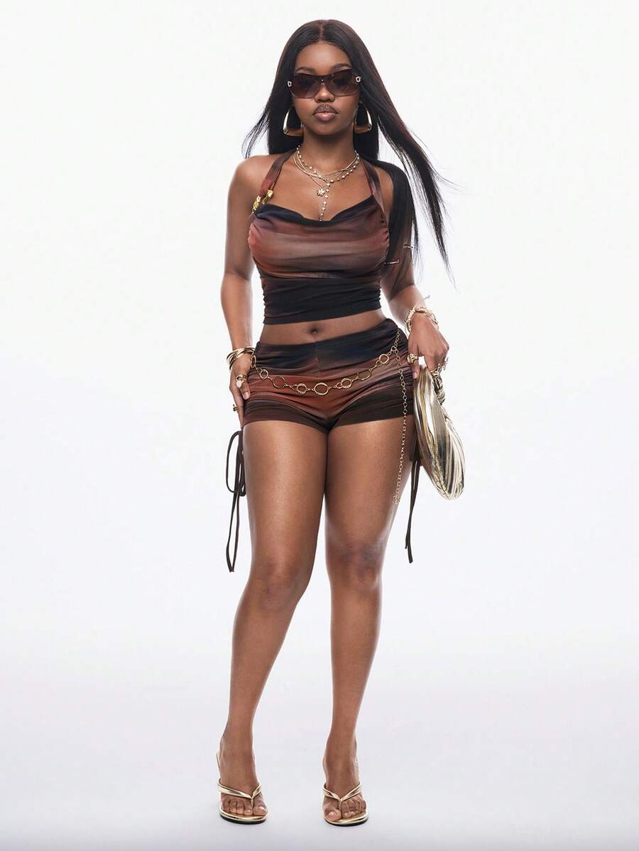 Women's two-piece vacation outfit featuring a multicolor halter crop top with ruched drawstring details and matching mini shorts.