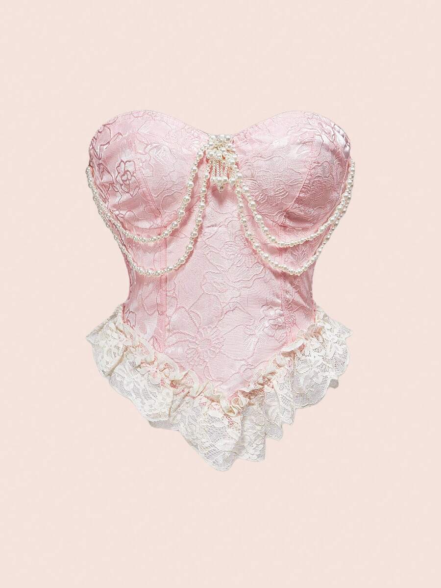 Women's apricot strapless vintage palace style blouse featuring an asymmetrical ruffle hem, backless design, and pearl brooch detail.