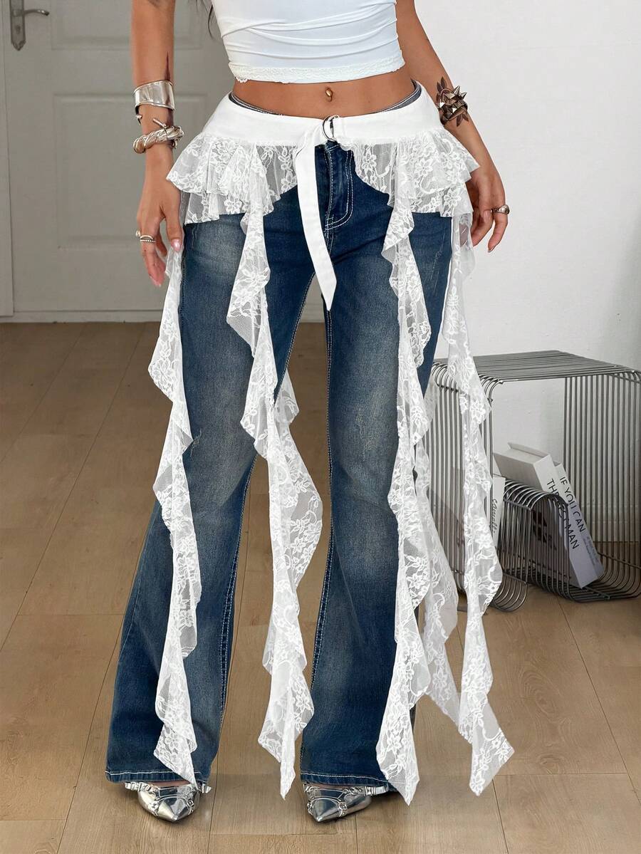Women's black semi-sheer lace asymmetrical skirt with fringe details, contrast lace, low waist, and ruffle hem for beach, party, concert, or festival outfits.