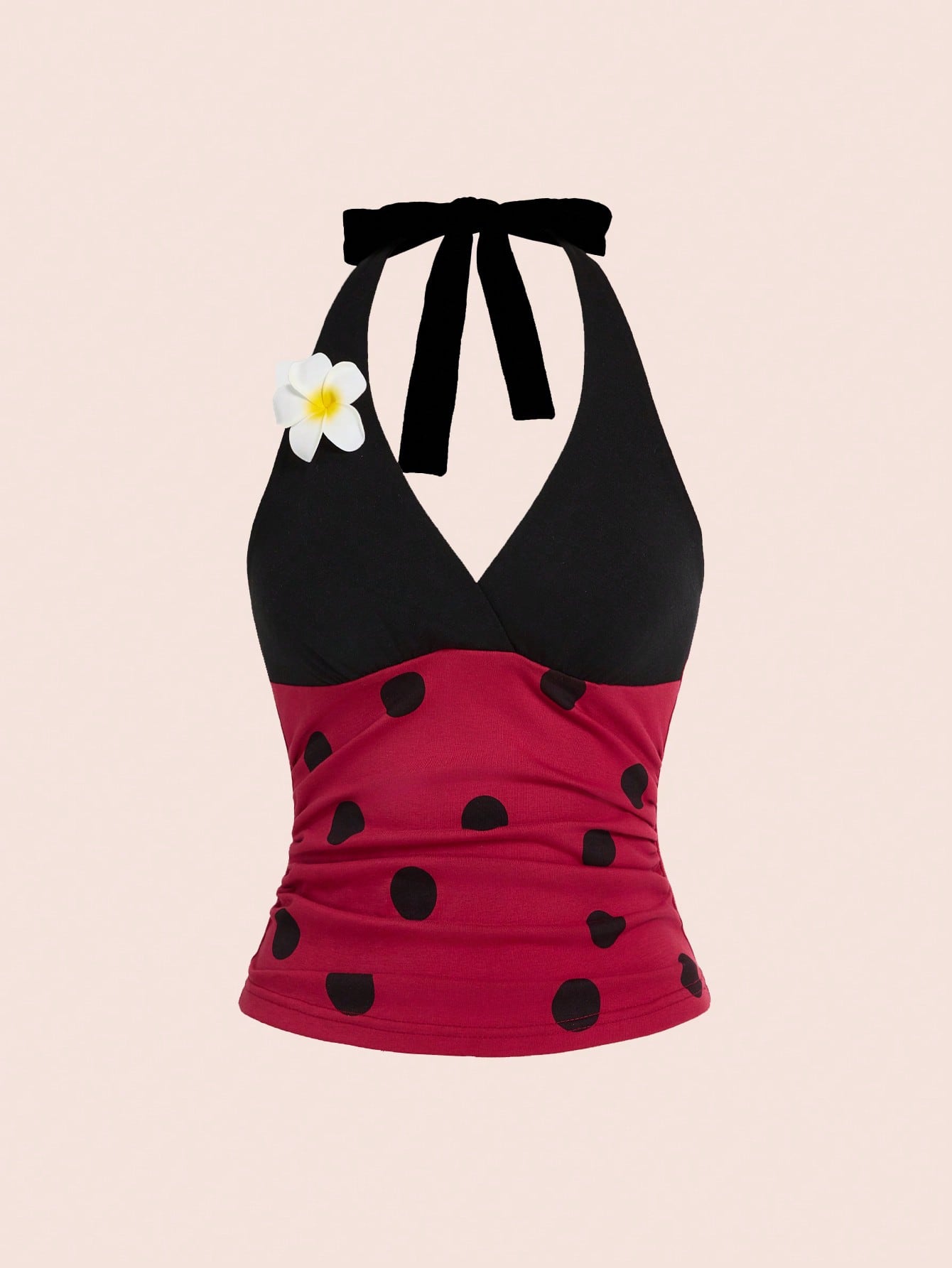 Women's black and white halter neck tank top with ladybug and daisy decor, geometric pattern, ruched front, knot detail, and backless design.