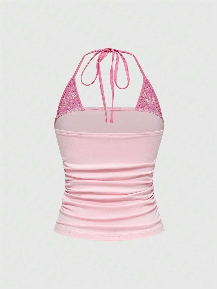 Women's cropped Y2K punk print halter cami top with contrast lace, backless knot detail, and slim fit knitted fabric