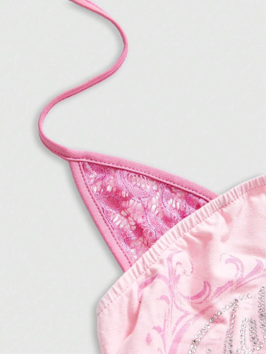 Women's cropped Y2K punk print halter cami top with contrast lace, backless knot detail, and slim fit knitted fabric