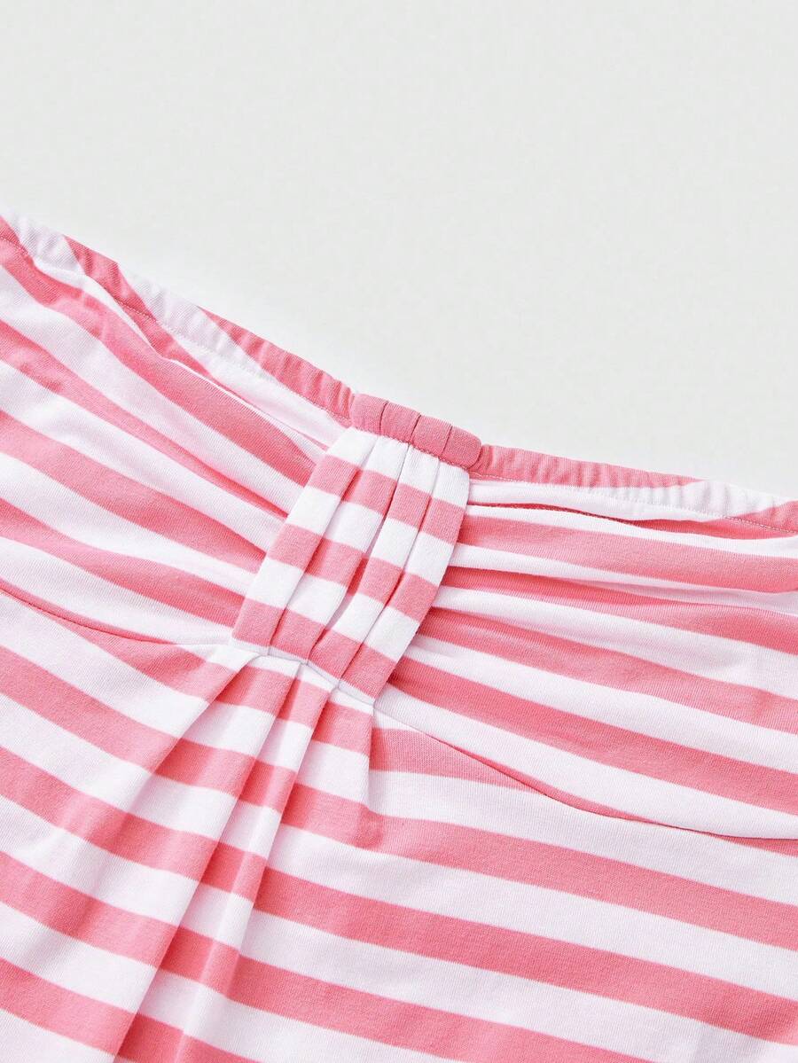 Women's striped strapless tube top featuring ruched detailing, flared hem, and stretchy knit fabric.