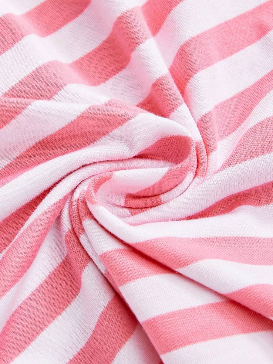 Women's striped strapless tube top featuring ruched detailing, flared hem, and stretchy knit fabric.