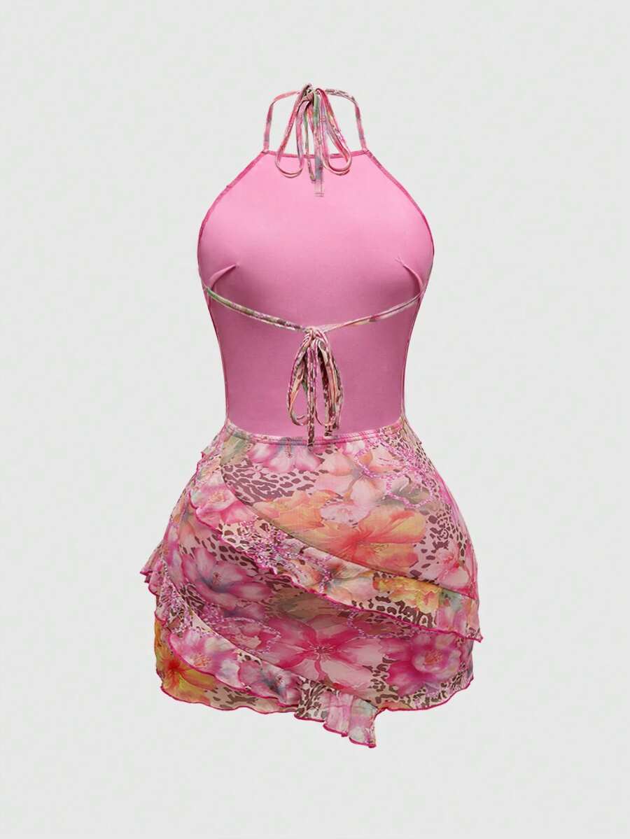 Women's brown boho halter mini dress with leopard and floral print, backless knot detail, contrast lace, slim fit, sleeveless cami style, and pencil hem.