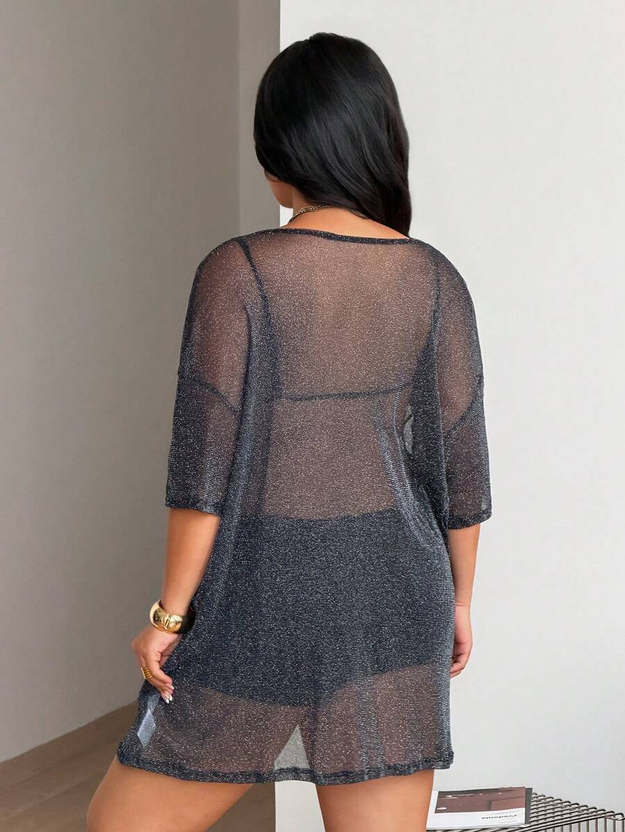 Women's plus size black sheer mesh top featuring a loose fit, round neck, and drop shoulder half sleeves.