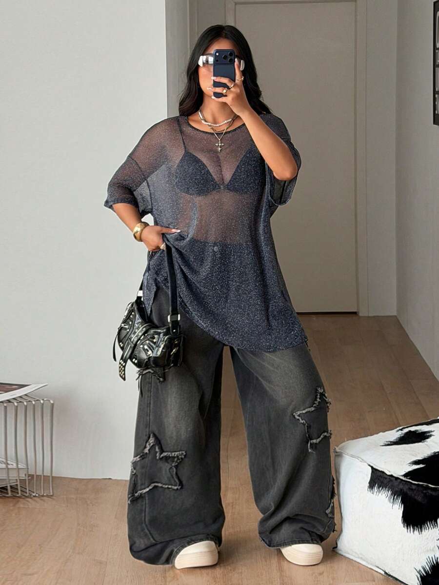 Women's plus size black sheer mesh top featuring a loose fit, round neck, and drop shoulder half sleeves.
