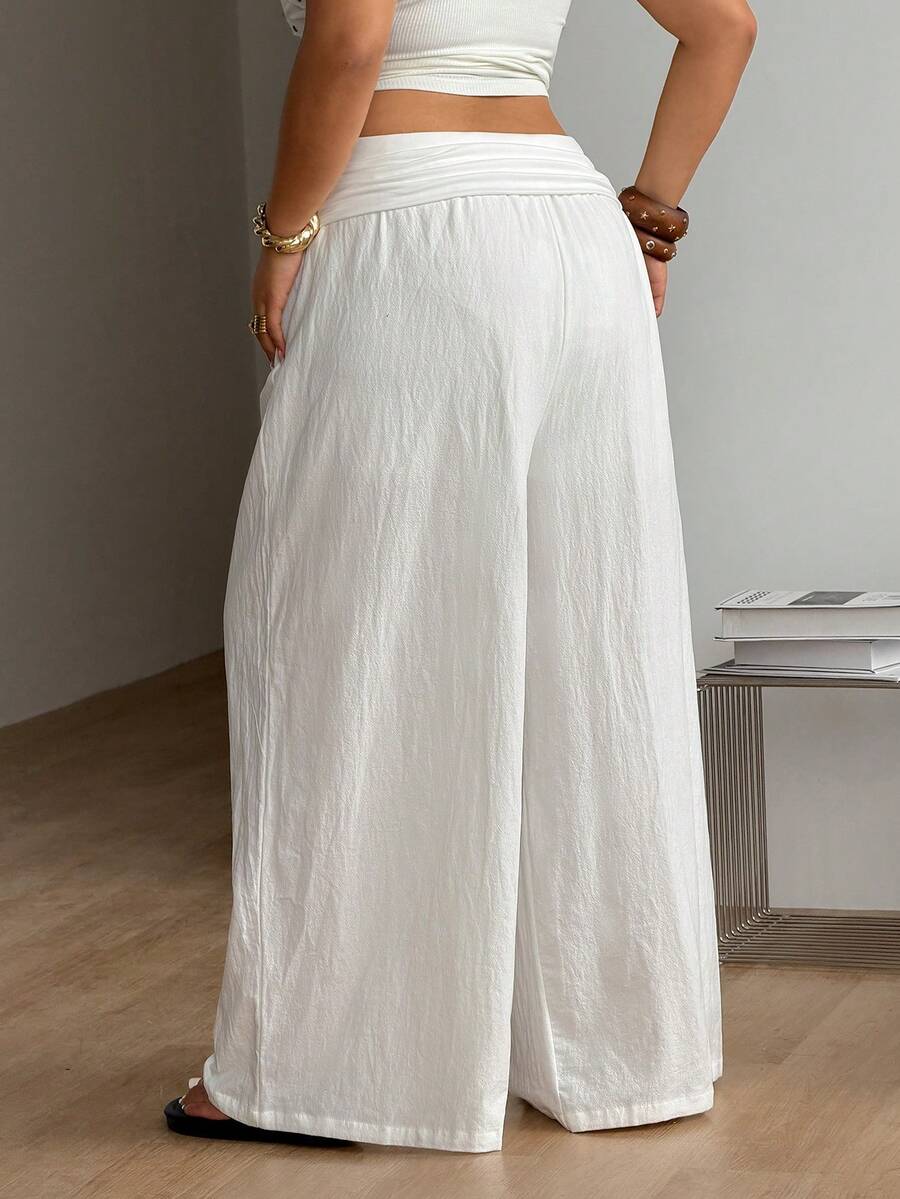 Women's plus size wide leg cotton pants featuring a relaxed loose fit and high waist design.