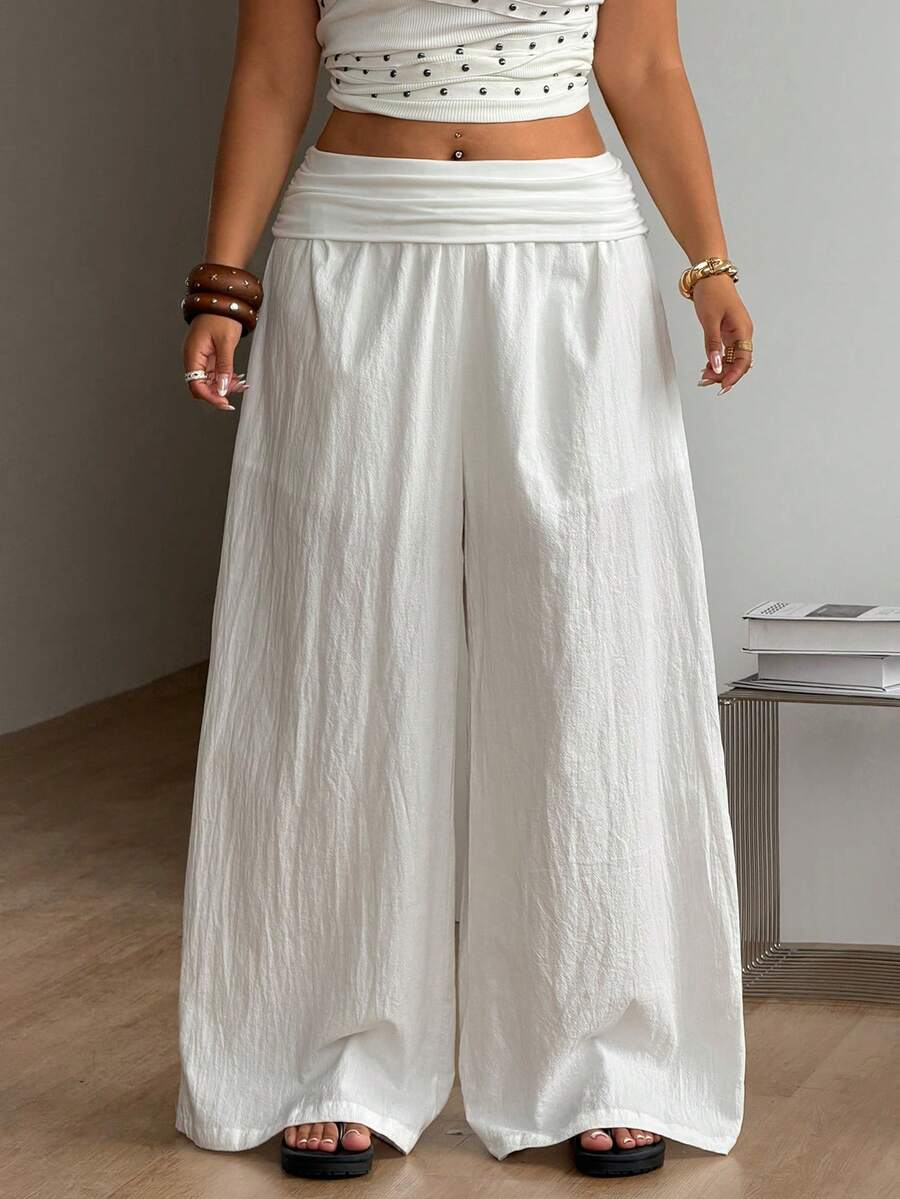 Women's plus size wide leg cotton pants featuring a relaxed loose fit and high waist design.