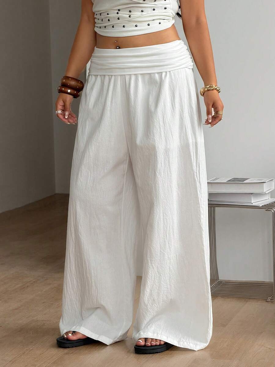 Women's plus size wide leg cotton pants featuring a relaxed loose fit and high waist design.