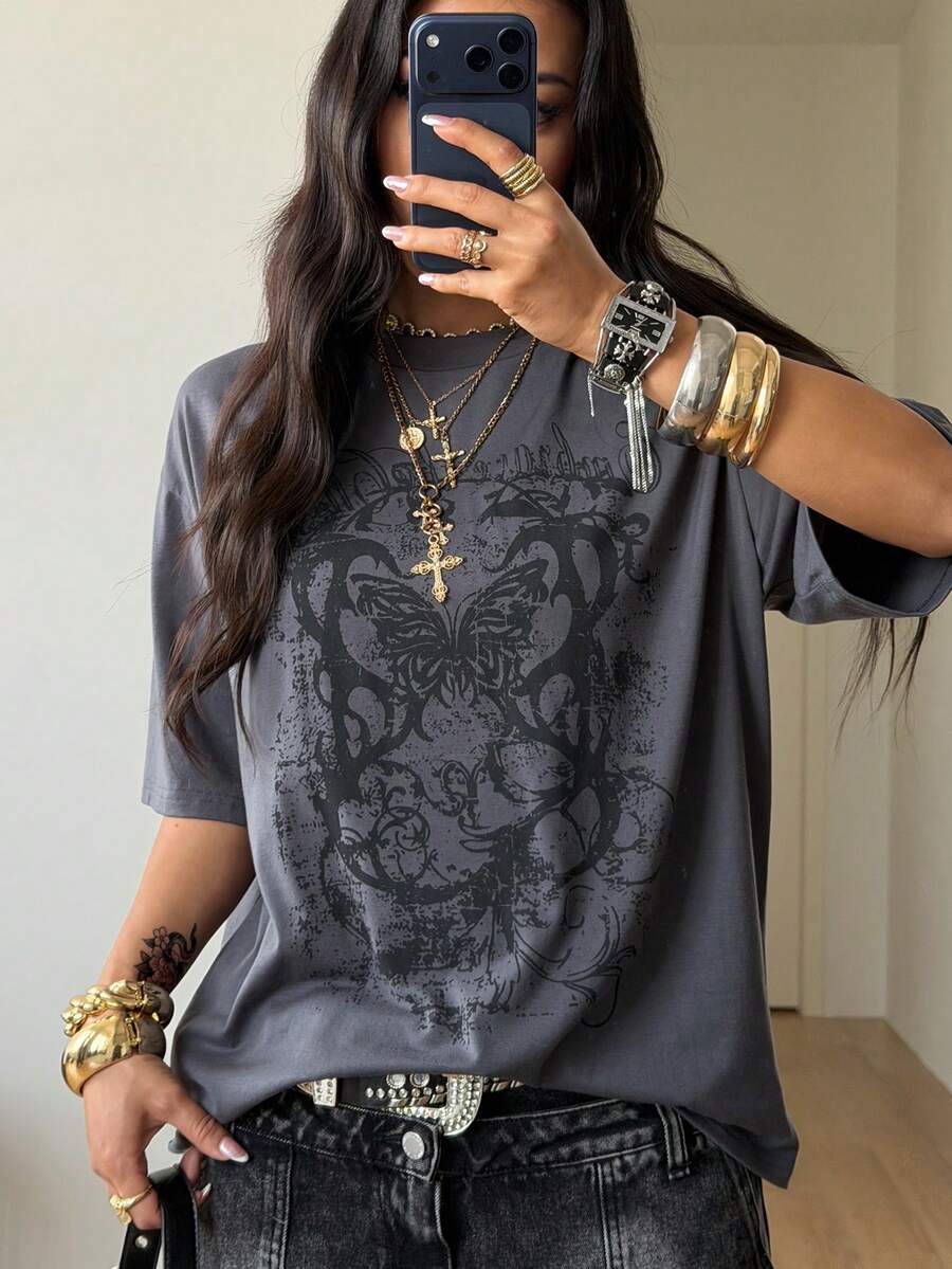 Unisex oversized grey graphic t-shirt featuring drop shoulder half sleeves, a round neckline, and a relaxed loose fit.