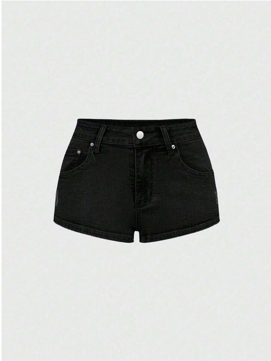 Women's ultra low waist mini shorts with back pockets, zipper fly, button detail, random print, and star patch in a grunge punk Y2K style.