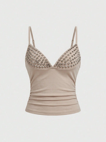 Women's slim fit sleeveless crop top featuring spaghetti straps, ruched detailing, and studded rhinestone accents.