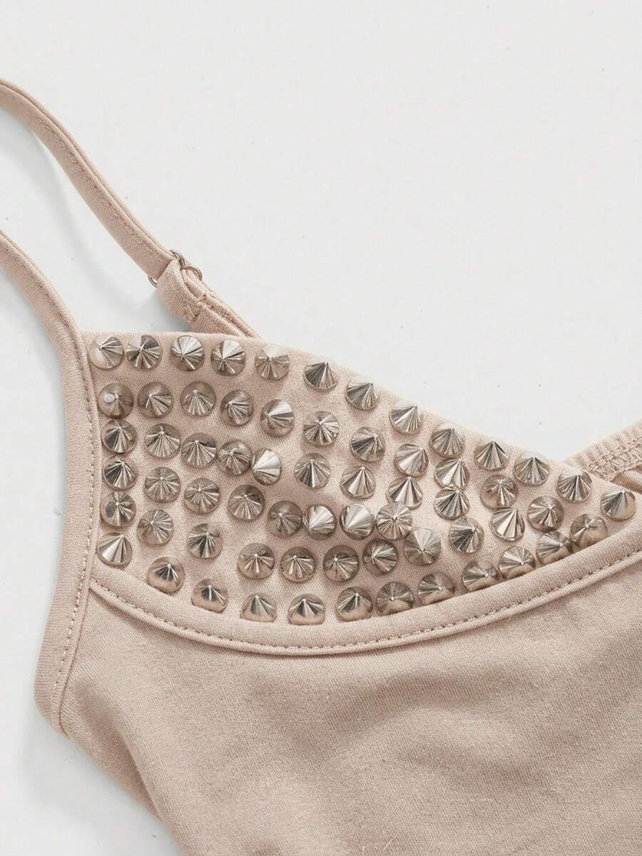 Women's slim fit sleeveless crop top featuring spaghetti straps, ruched detailing, and studded rhinestone accents.