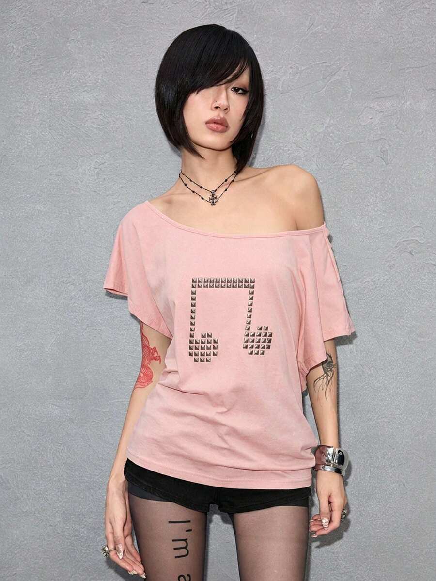 Women's grunge punk style short sleeve t-shirt featuring an asymmetrical neckline, hollow-out cut detail, and relaxed batwing sleeves in a soft cotton stretch fabric.