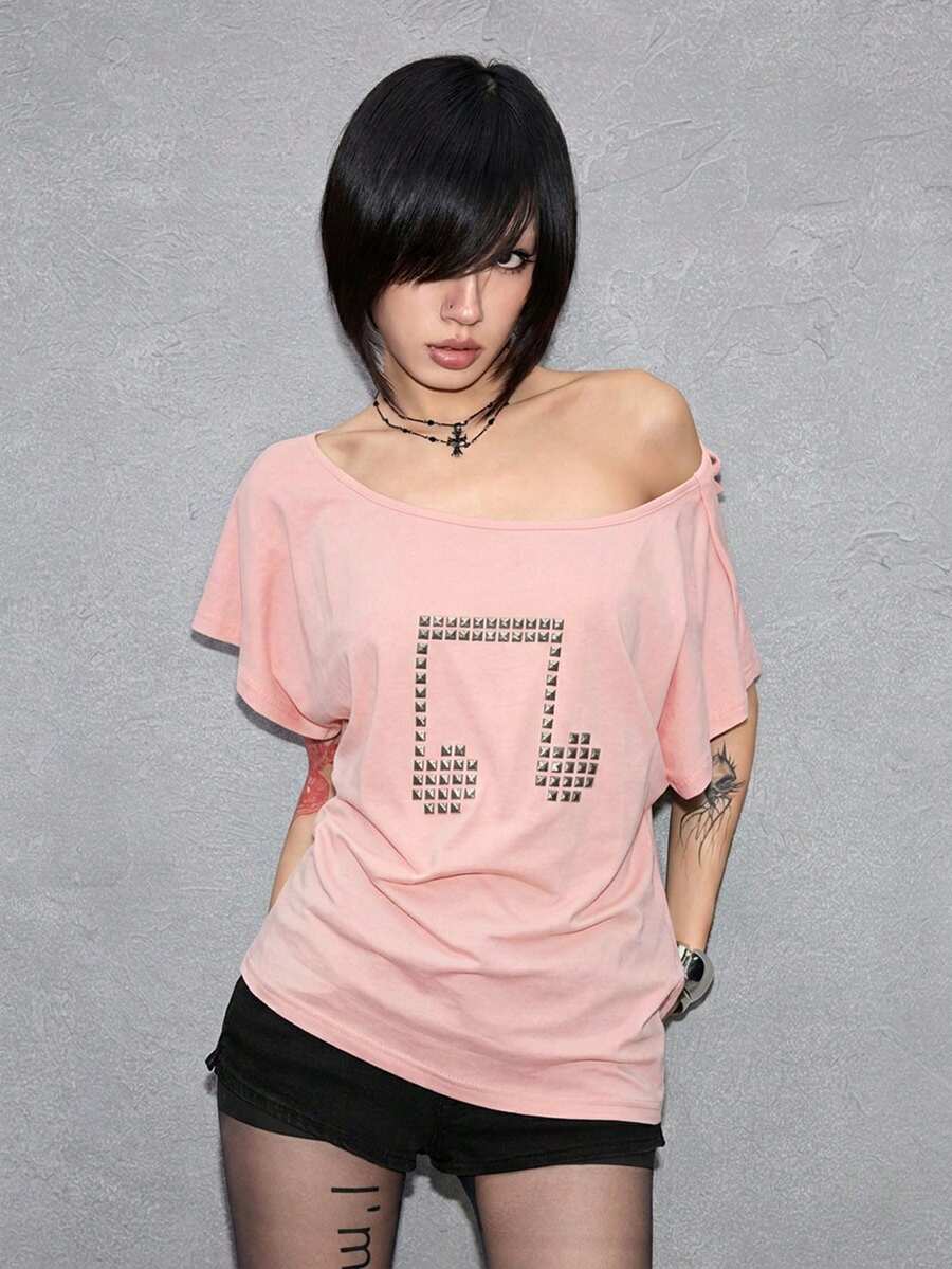 Women's grunge punk style short sleeve t-shirt featuring an asymmetrical neckline, hollow-out cut detail, and relaxed batwing sleeves in a soft cotton stretch fabric.