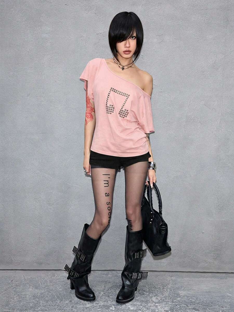 Women's grunge punk style short sleeve t-shirt featuring an asymmetrical neckline, hollow-out cut detail, and relaxed batwing sleeves in a soft cotton stretch fabric.
